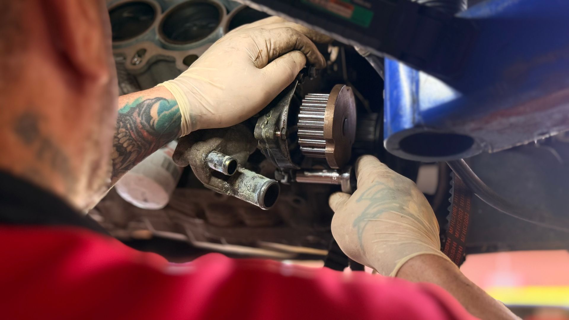 Mechanic in gloves working | Sky Auto Express