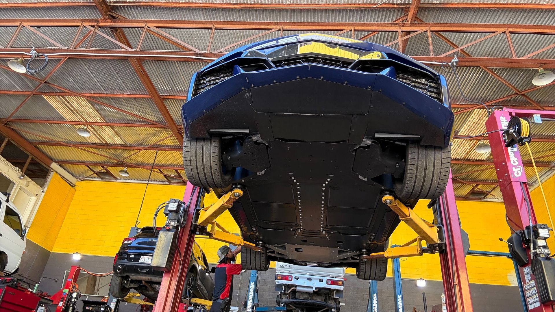 Auto repair garage with the undercarriage exposed | Sky Auto Express