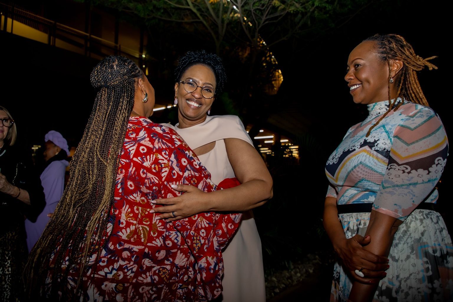 Chevelle Franklyn greeting conference participants at All Women Together 2026, Kigali.