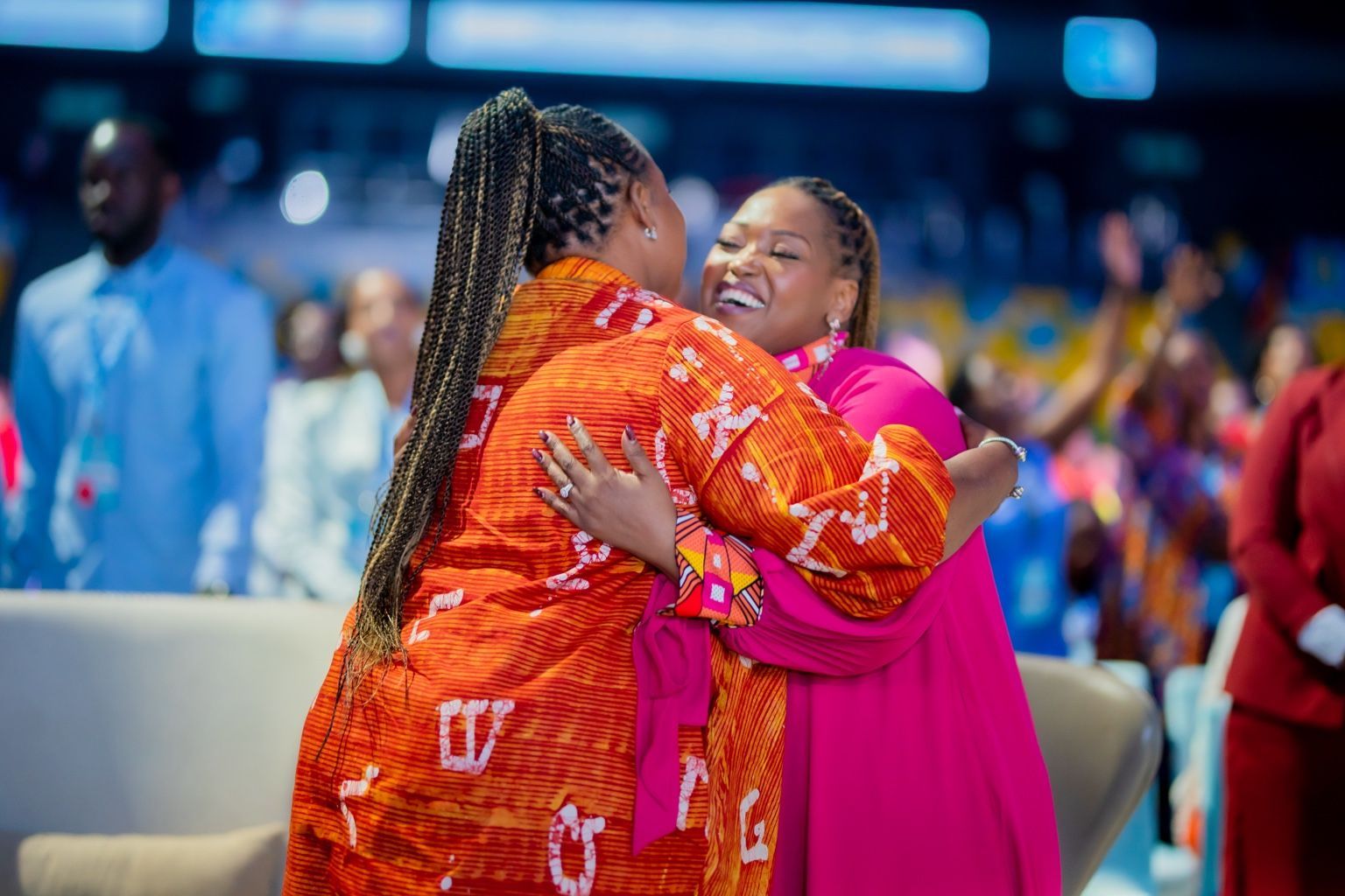 Chevelle Franklyn embracing a fellow conference participant at All Women Together 2026, Kigali.