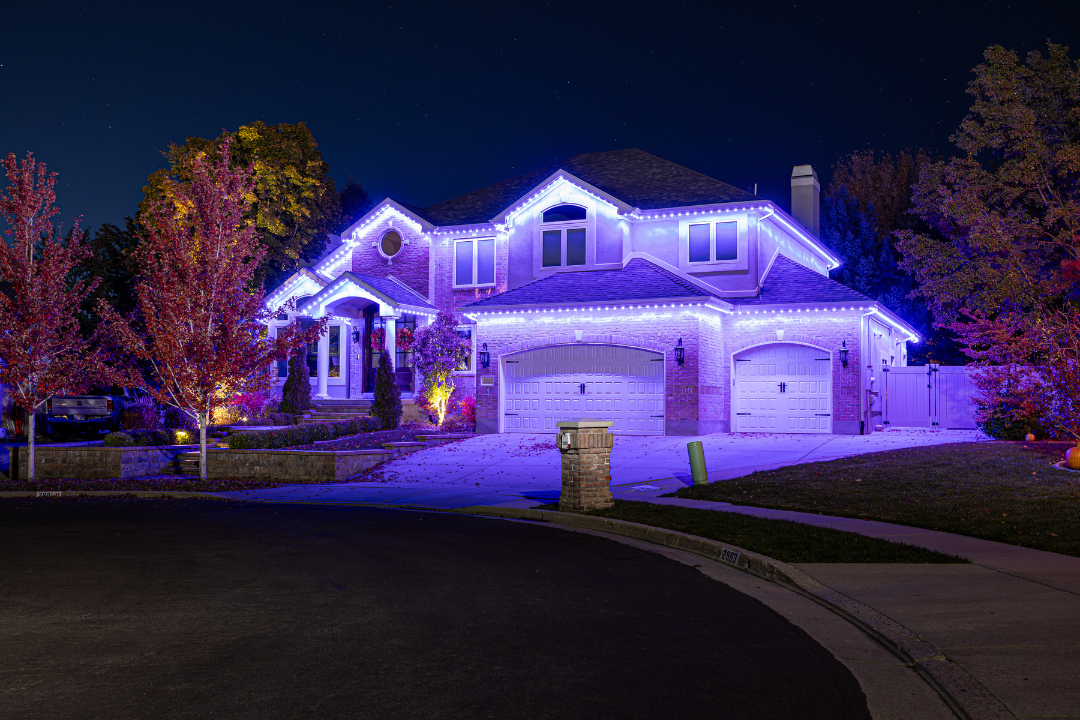House decorated with blue lights at night.