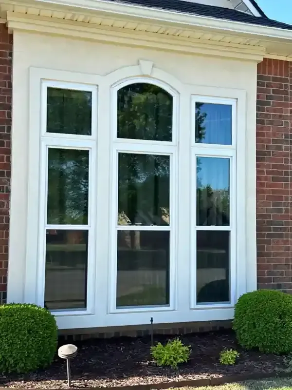 Exterior view of a home featuring professionally installed energy-efficient windows for better insulation
