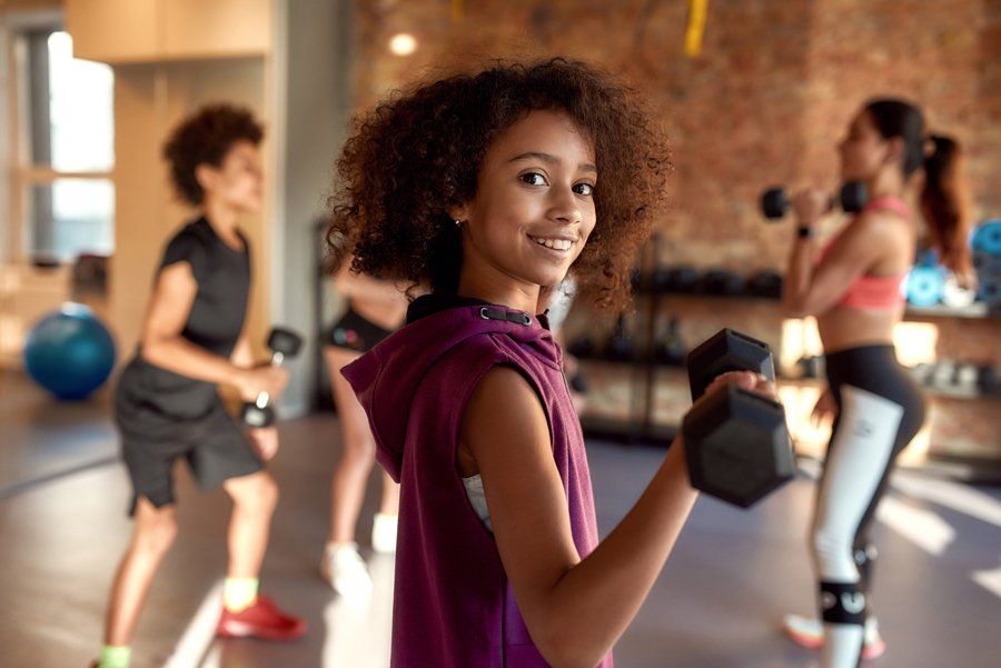 Kid With Dumbbell – Saint Louis, MO – Eager Beaver Fitness