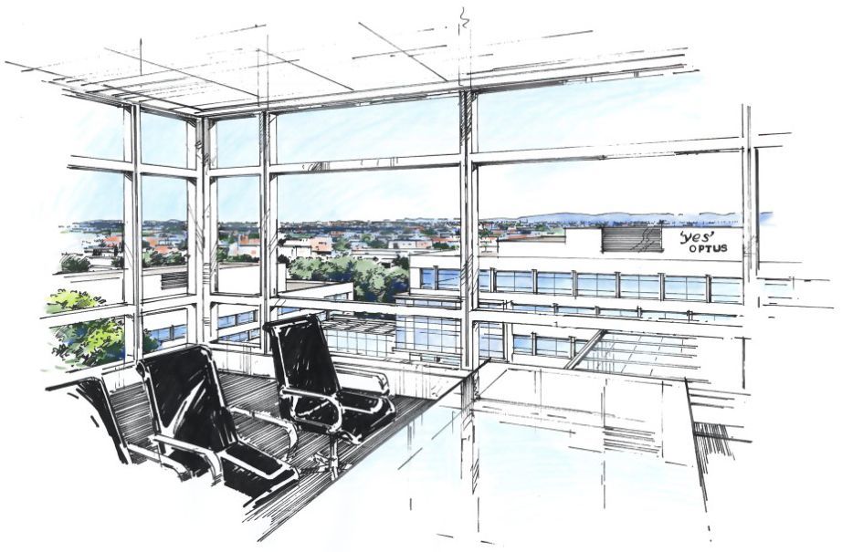 Modern office corner with large windows, black chairs, and a city view beyond the glass.