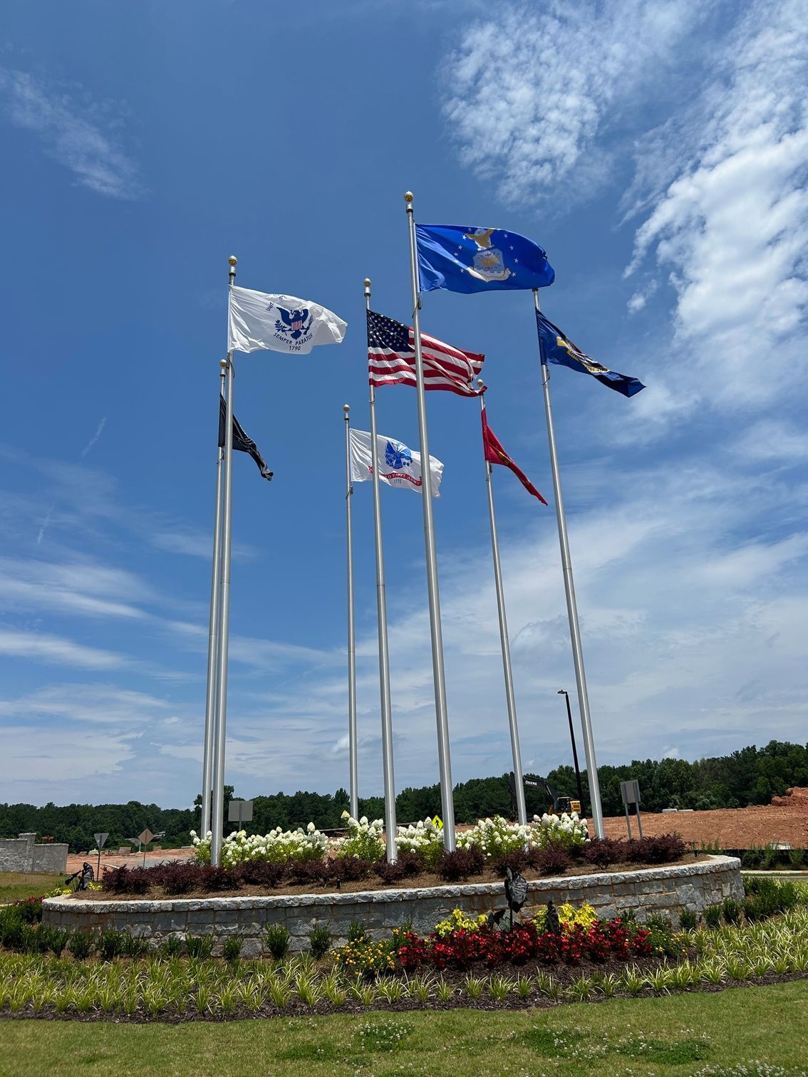 Circular Display of Flagpoles with American and Military Flags
