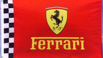 A red flag with a ferrari logo on it