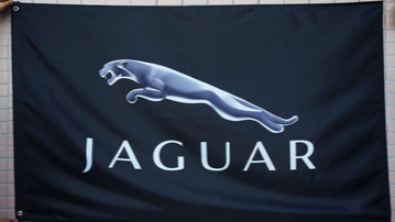 A black flag with a jaguar logo on it