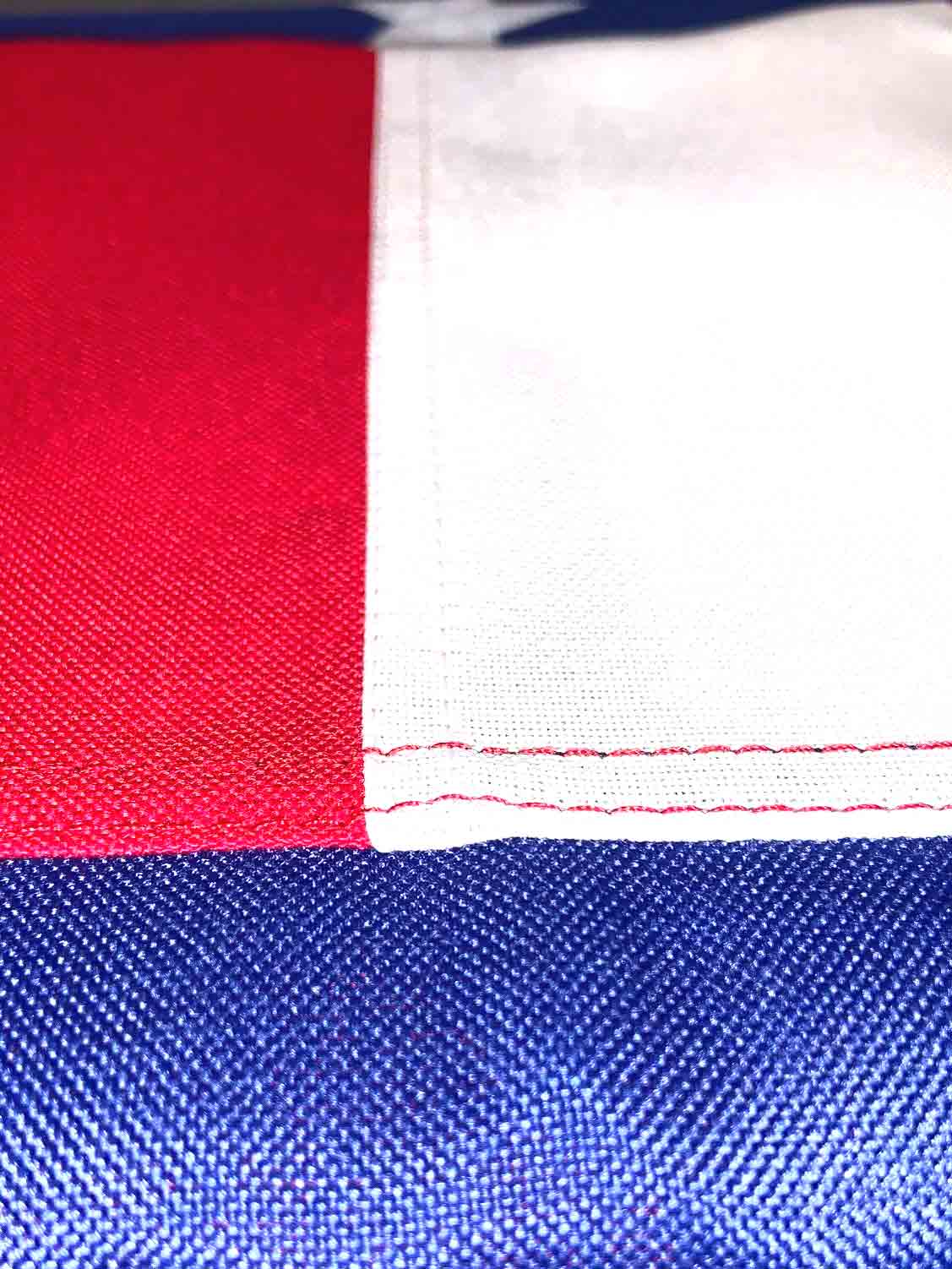 A close up of a red , white and blue american flag.