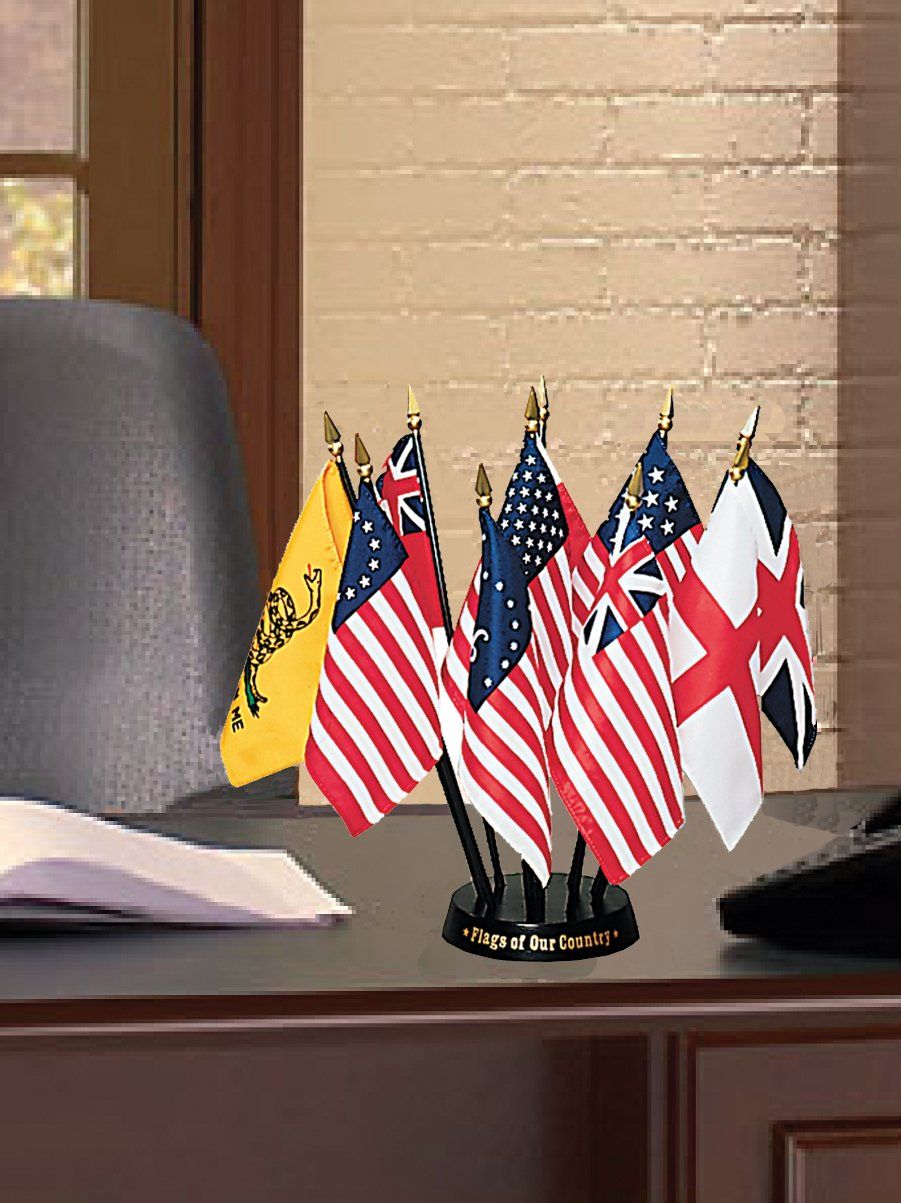 A desk with a bunch of small flags on it