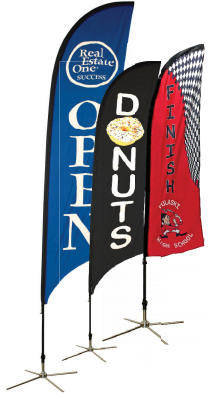 Three flags with one that says donuts on it
