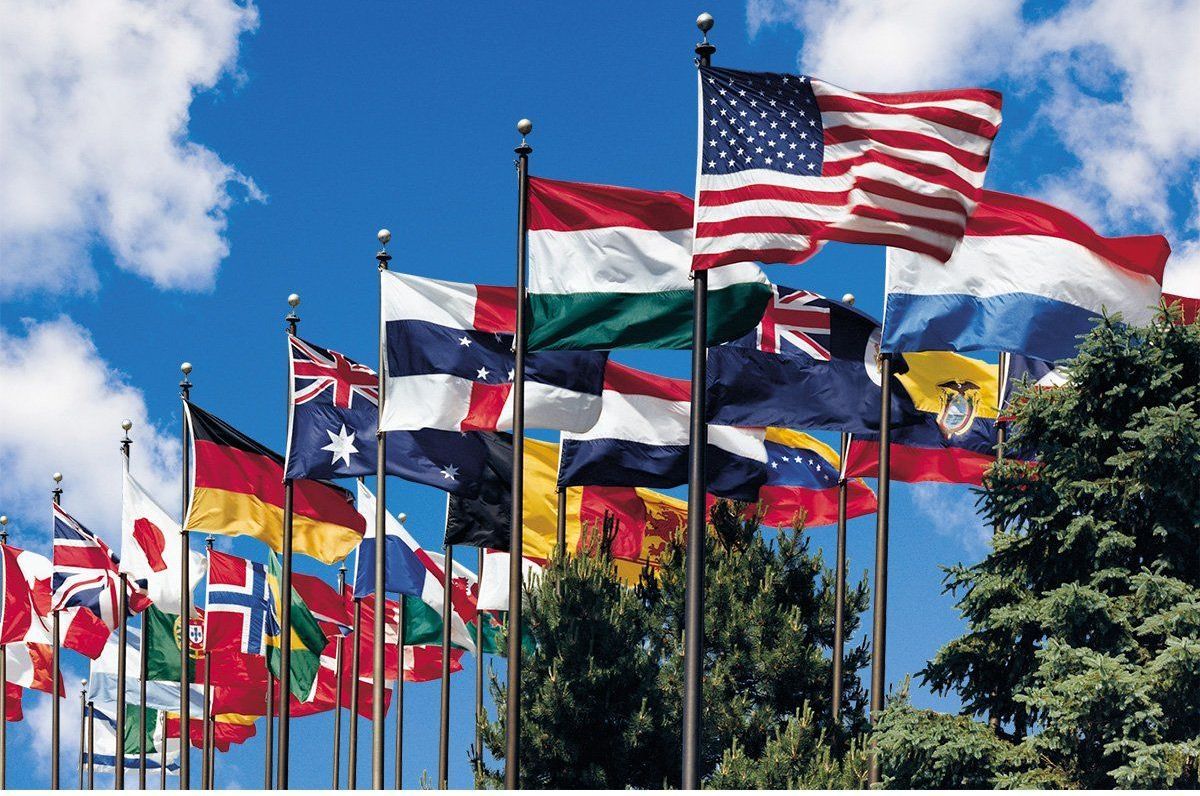 A bunch of flags are waving in the wind