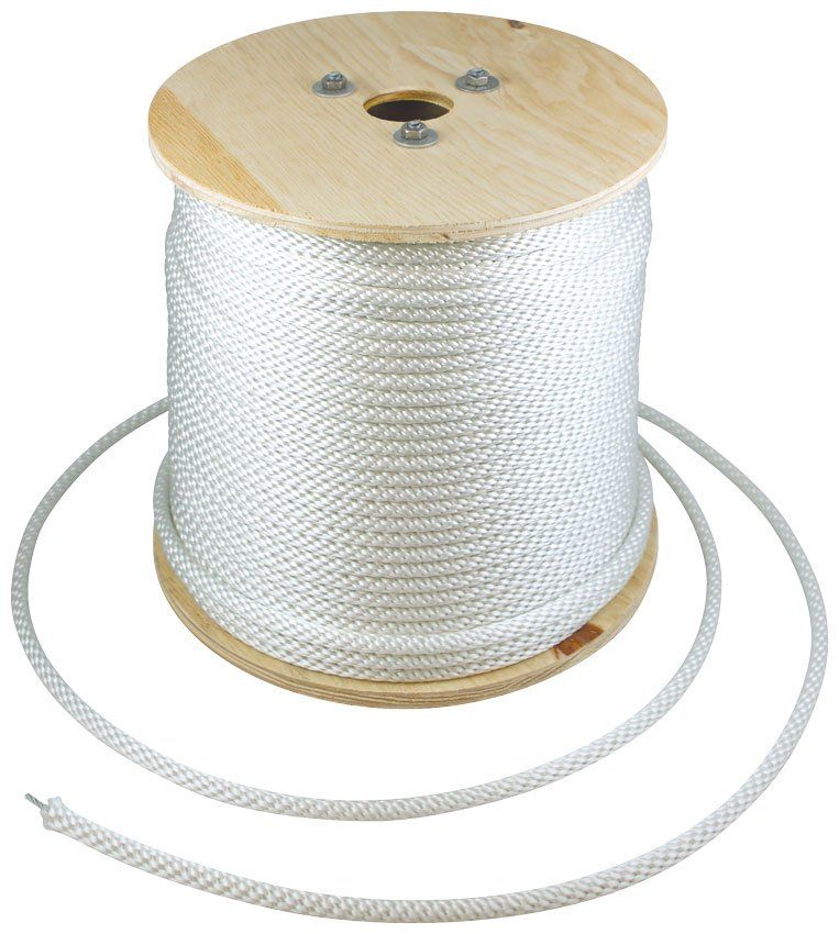 A wooden spool of white rope with a hole in the middle