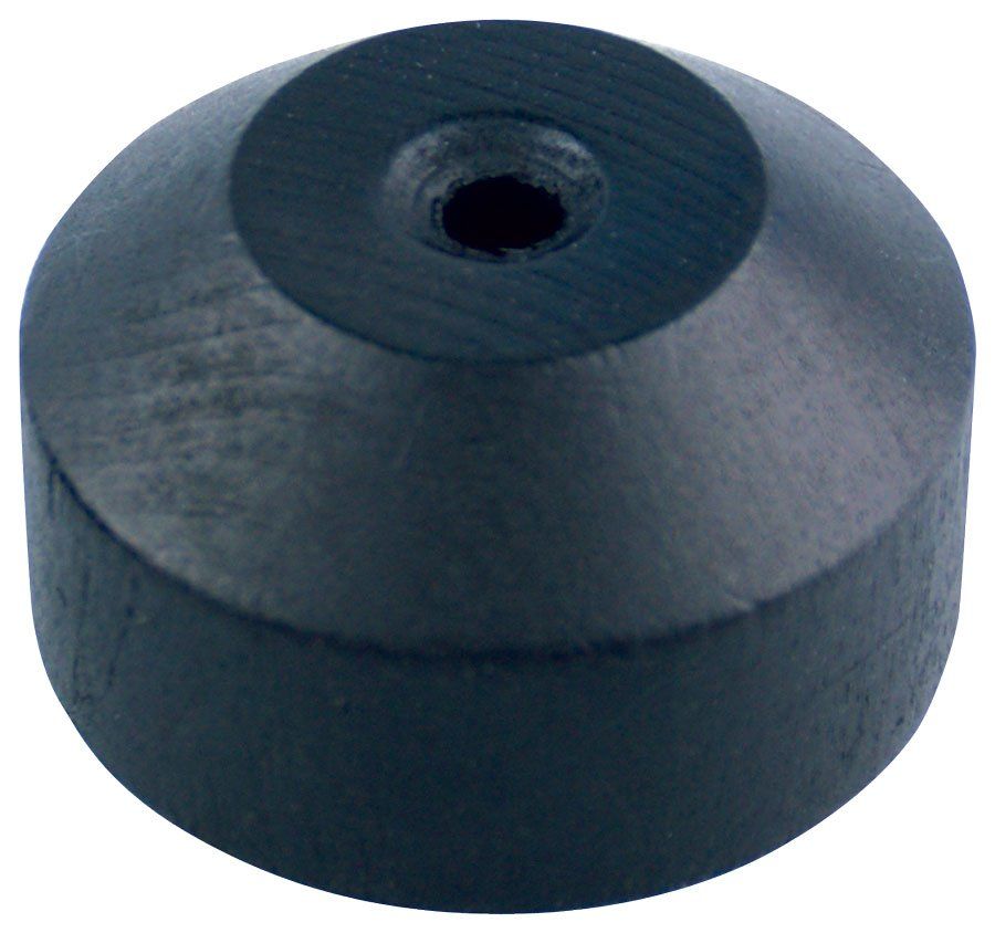A black rubber block with a hole in the middle