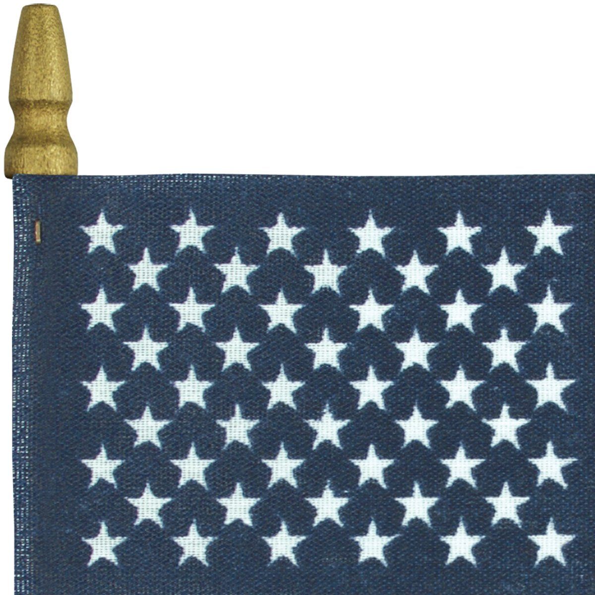 A small american flag with white stars on a blue background