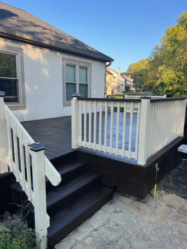 Before-and-after view of a weathered wooden deck, showing cleaning or restoration results.