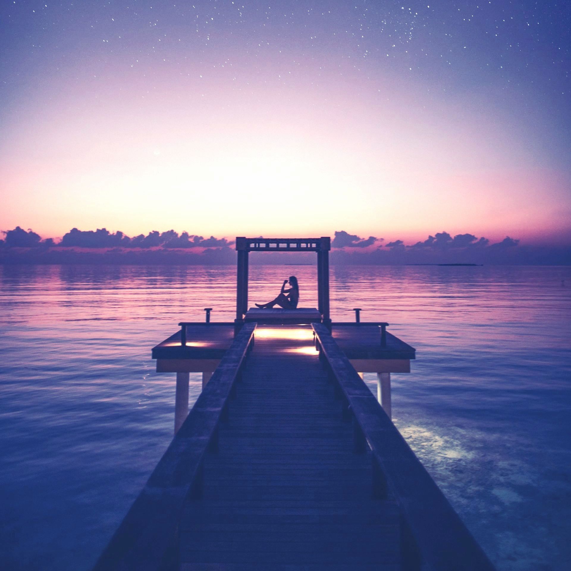Person on a dock by a lake