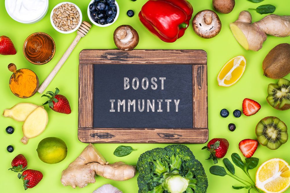 There is a sign that says `` boost immunity '' surrounded by fruits and vegetables.