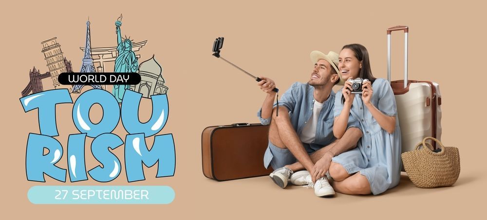 A man and a woman are sitting on the floor with suitcases and taking a selfie.