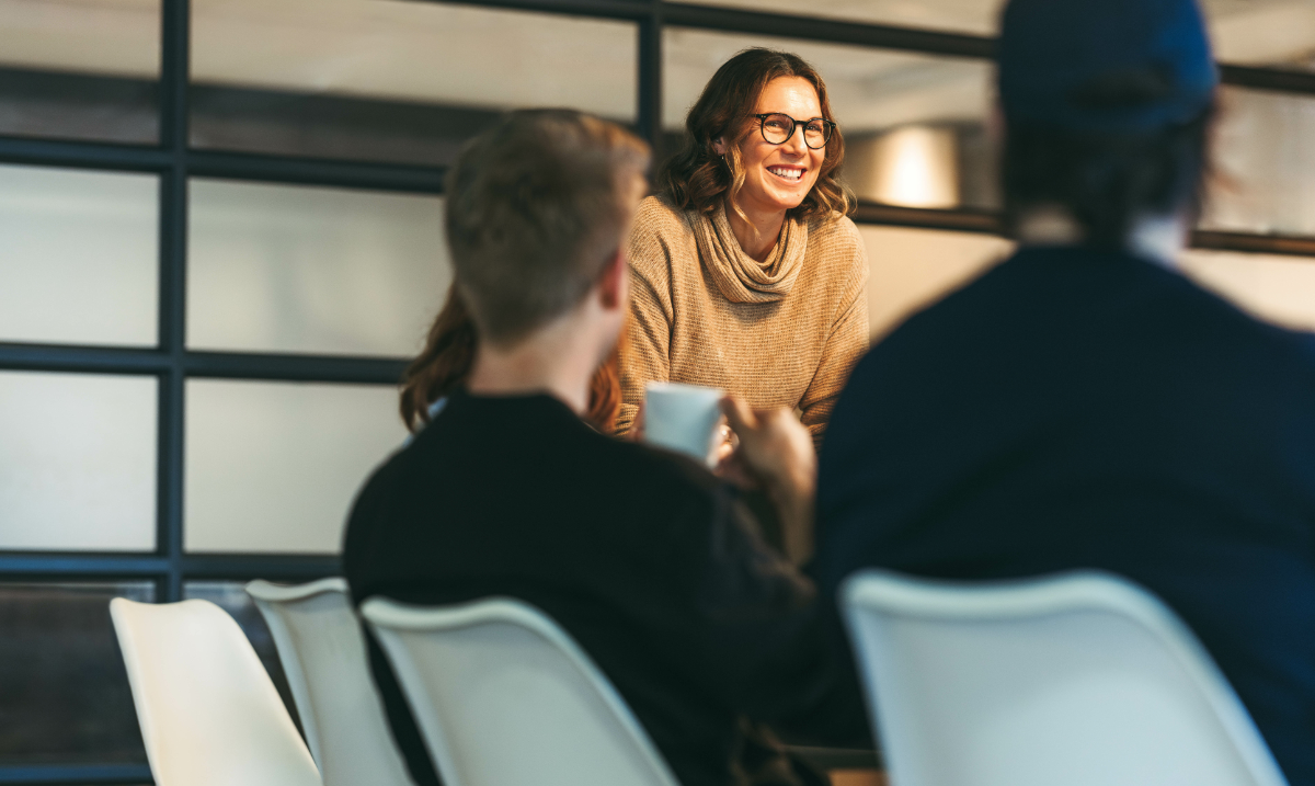 Professional woman leading a meeting discussion about people strategy and HR leadership in a healtht