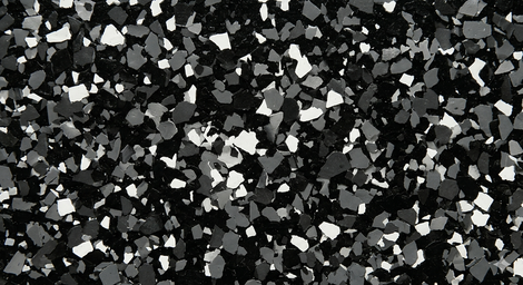 Black, white, and gray speckled mosaic texture with irregular stone-like fragments