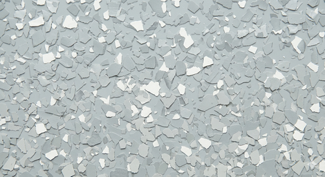 Light gray speckled terrazzo-like surface with scattered white chips