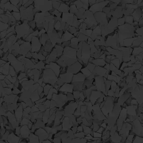 Pile of dark gray charcoal or crushed stones filling the frame
