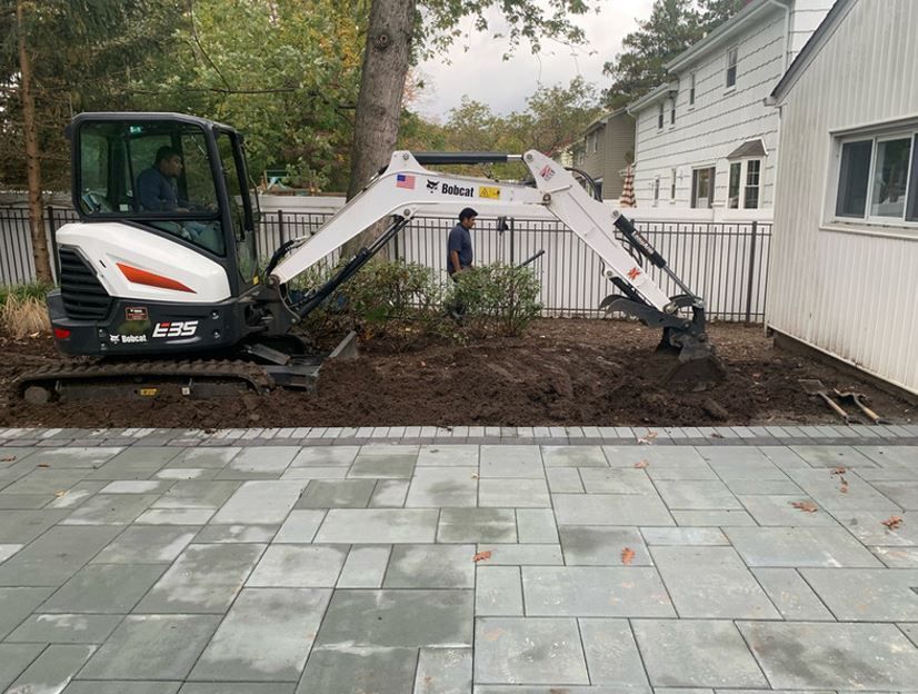 Digging Soil — Westwood, NJ — Four Brothers Landscape, Inc.