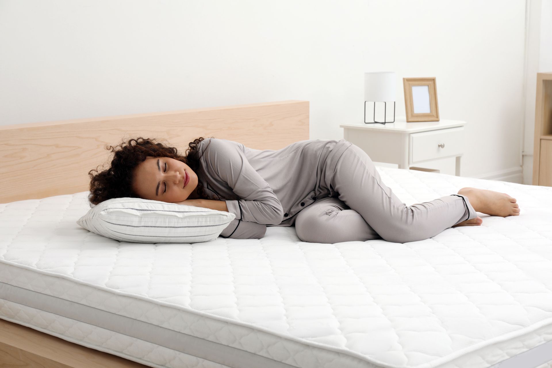 woman laying on a comfortable mattress