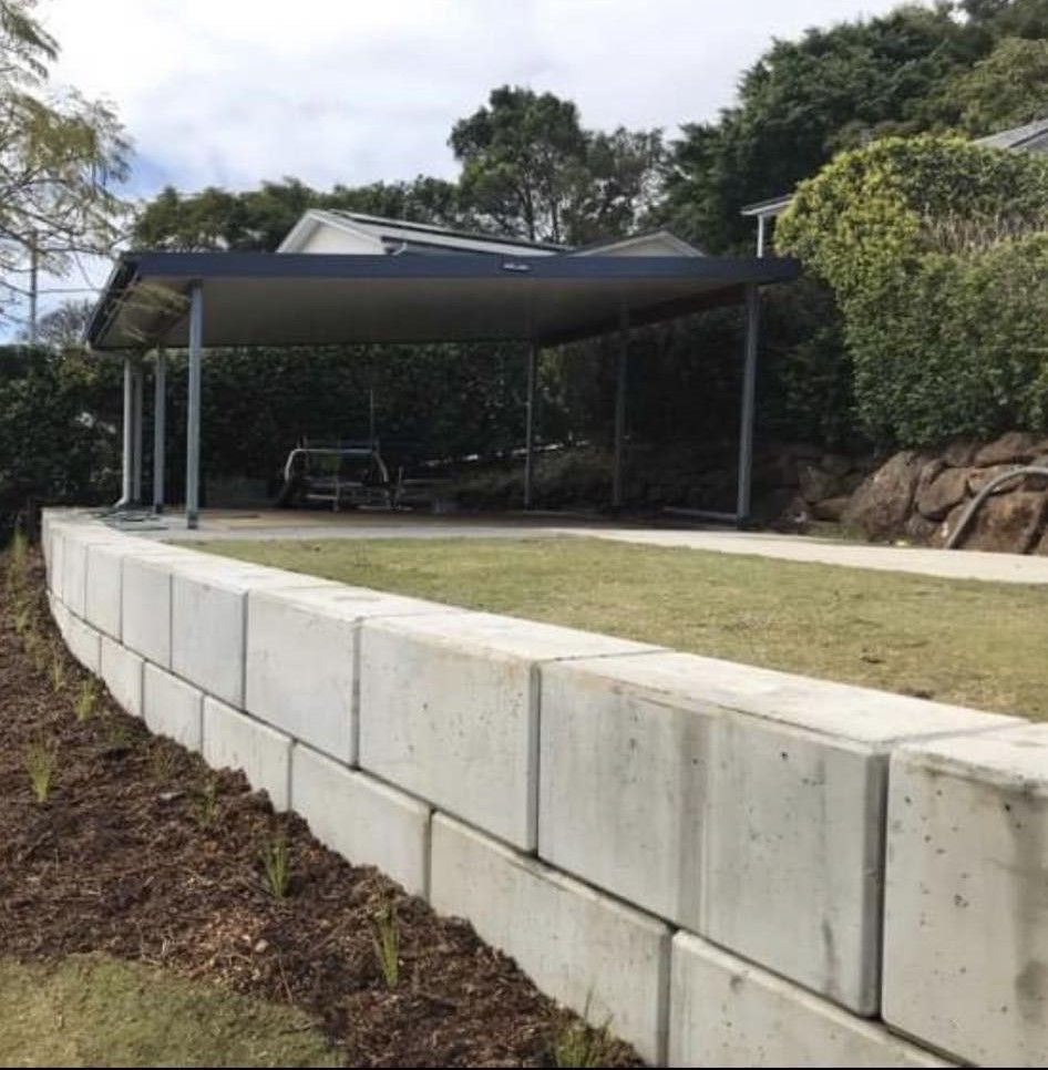 Row Of Concrete Blocks Are Stacked On Top Of Each Other In A to make a wall — Providing Steel & Concrete Construction In Eviron, NSW