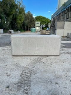 A Large White Block is Sitting on a Concrete Surface — Providing Steel & Concrete Construction In Eviron, NSW