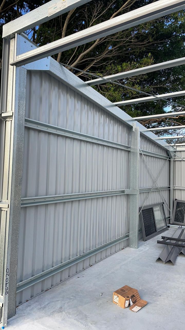 A Metal Structure is Being Built on a Concrete Floor — Providing Steel & Concrete Construction In Eviron, NSW