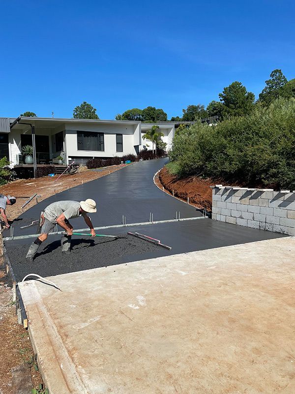 Man Working The Concrete Road — CJR Group Concrete Construction In Gold Coast, QLD