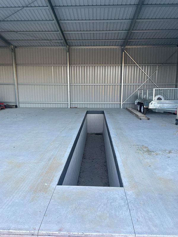 There Is A Hole In The Floor In The Middle Of The Sheds Slab — CJR Group Concrete Construction In Gold Coast, QLD