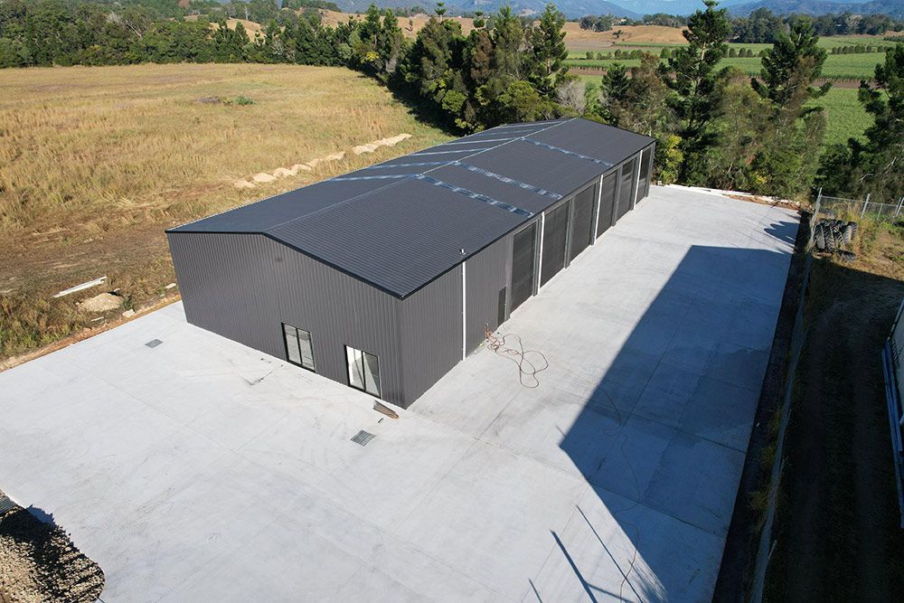 An Aerial View Of A Large Shed Building — CJR Group Concrete Construction In Gold Coast, QLD