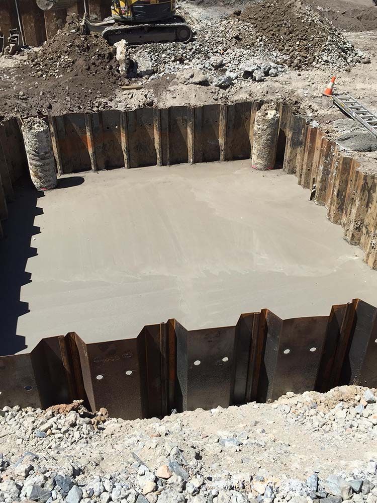 Large Hole In The Ground Is Being Filled With Concrete — Providing Steel & Concrete Construction In Tweed Heads, NSW