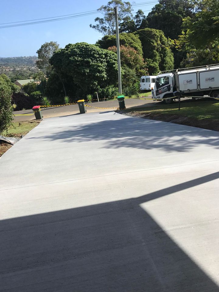A White Truck is Parked on the Side of the Road — Providing Steel & Concrete Construction In Eviron, NSW