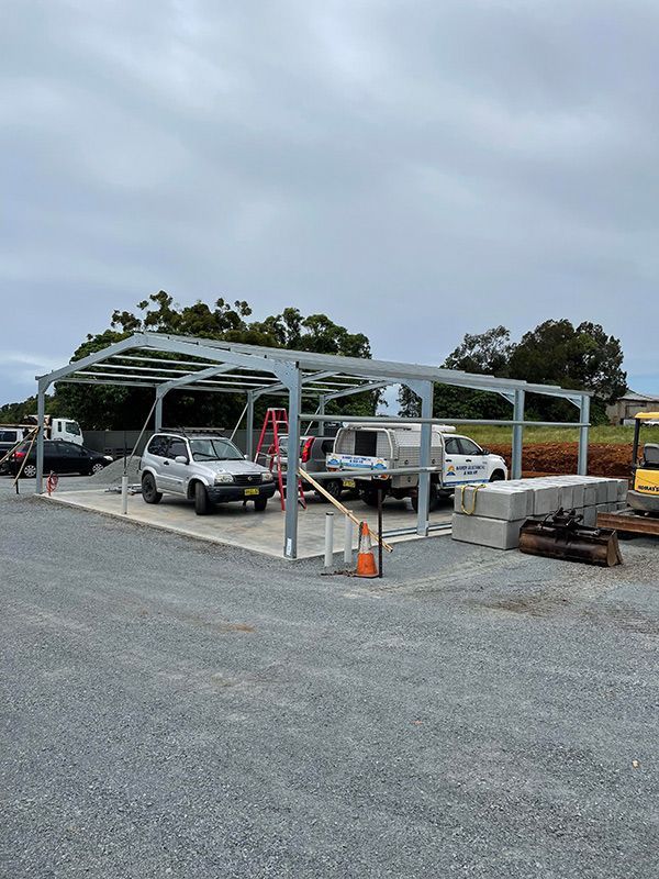 Structure Of The Shed With Two Vehicle Parked Inside — CJR Group Concrete Construction In Lismore, NSW
