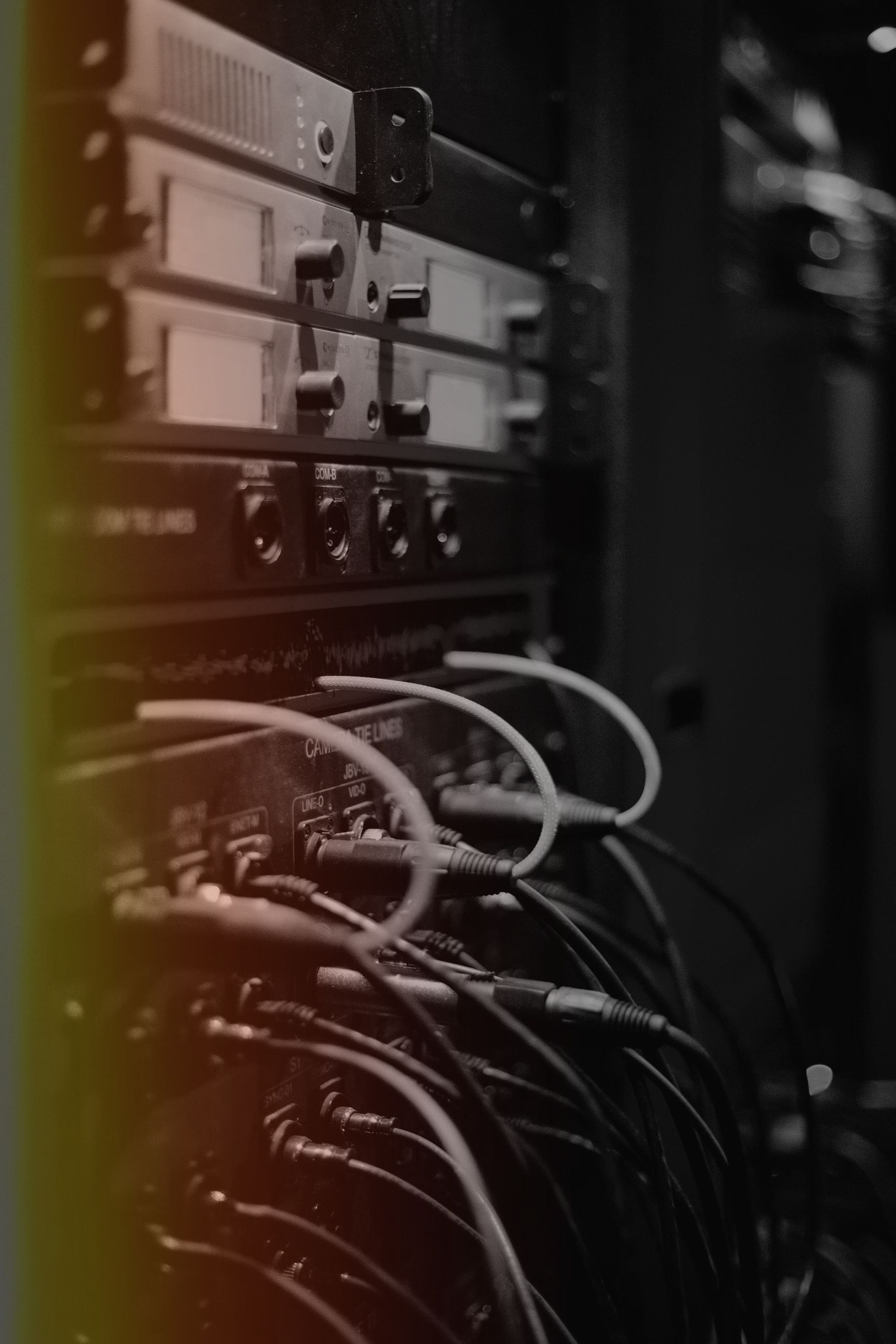 Network server rack with tangled cables and blinking equipment lights
