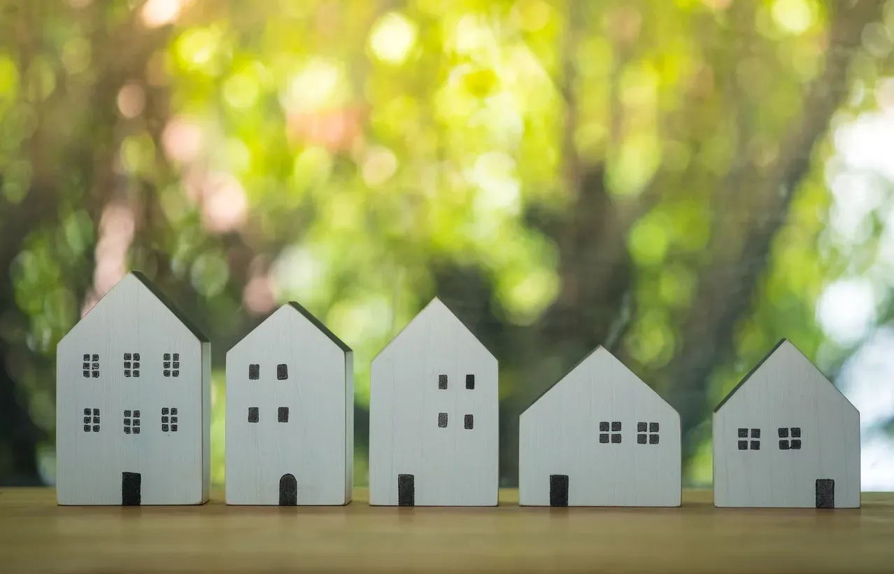 Different types of homes displayed in a row.