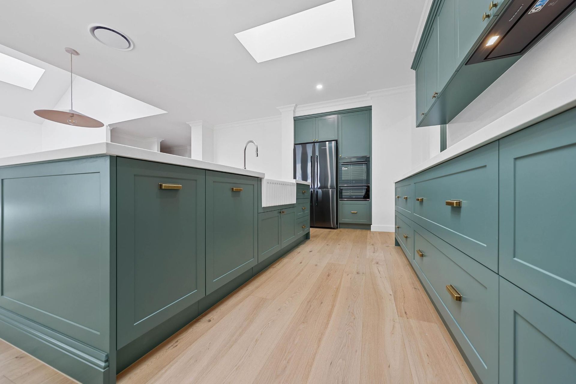 Modern kitchen with grey cabinetry , built-in gas cooktop, and under-cabinet lighting, kitchen rennovation in Wollongong — Above & Beyond Interiors in Wollongong, NSW