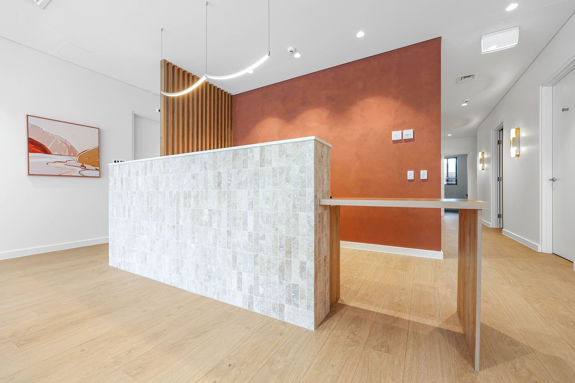 Modern Office Reception Area With a White Stone-front Desk — Above & Beyond Interiors in Smeaton Grange, NSW