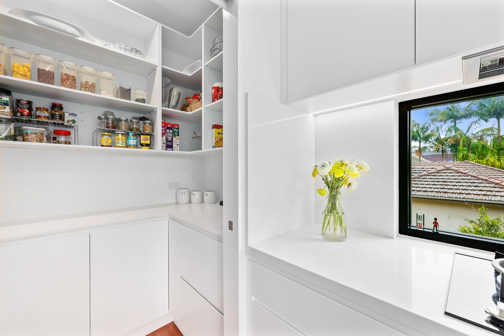 Bright White Pantry and Counter with Open Shelves — Above & Beyond Interiors in Smeaton Grange, NSW
