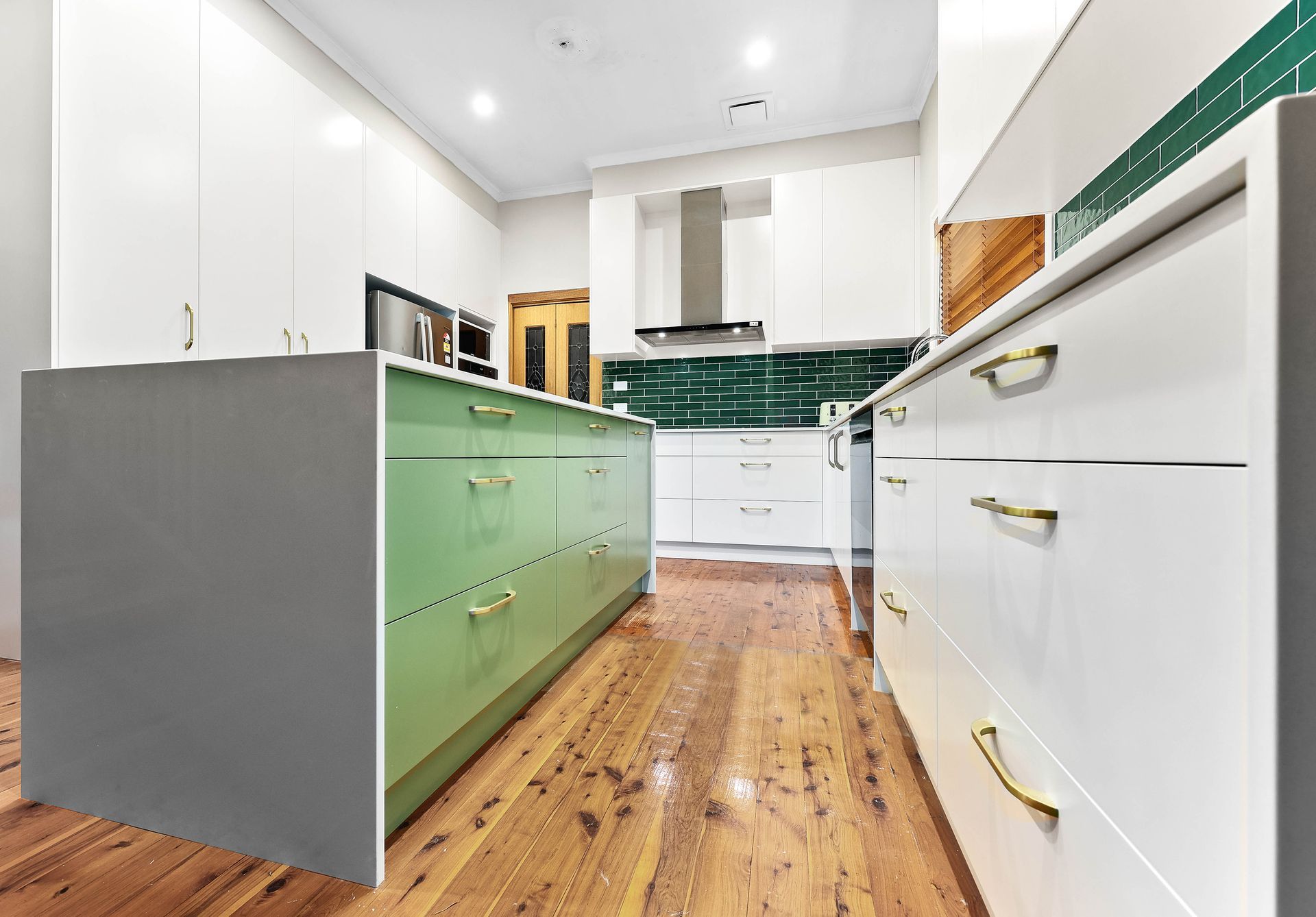 Modern Kitchen with White Cabinets — Above & Beyond Interiors in Smeaton Grange, NSW
