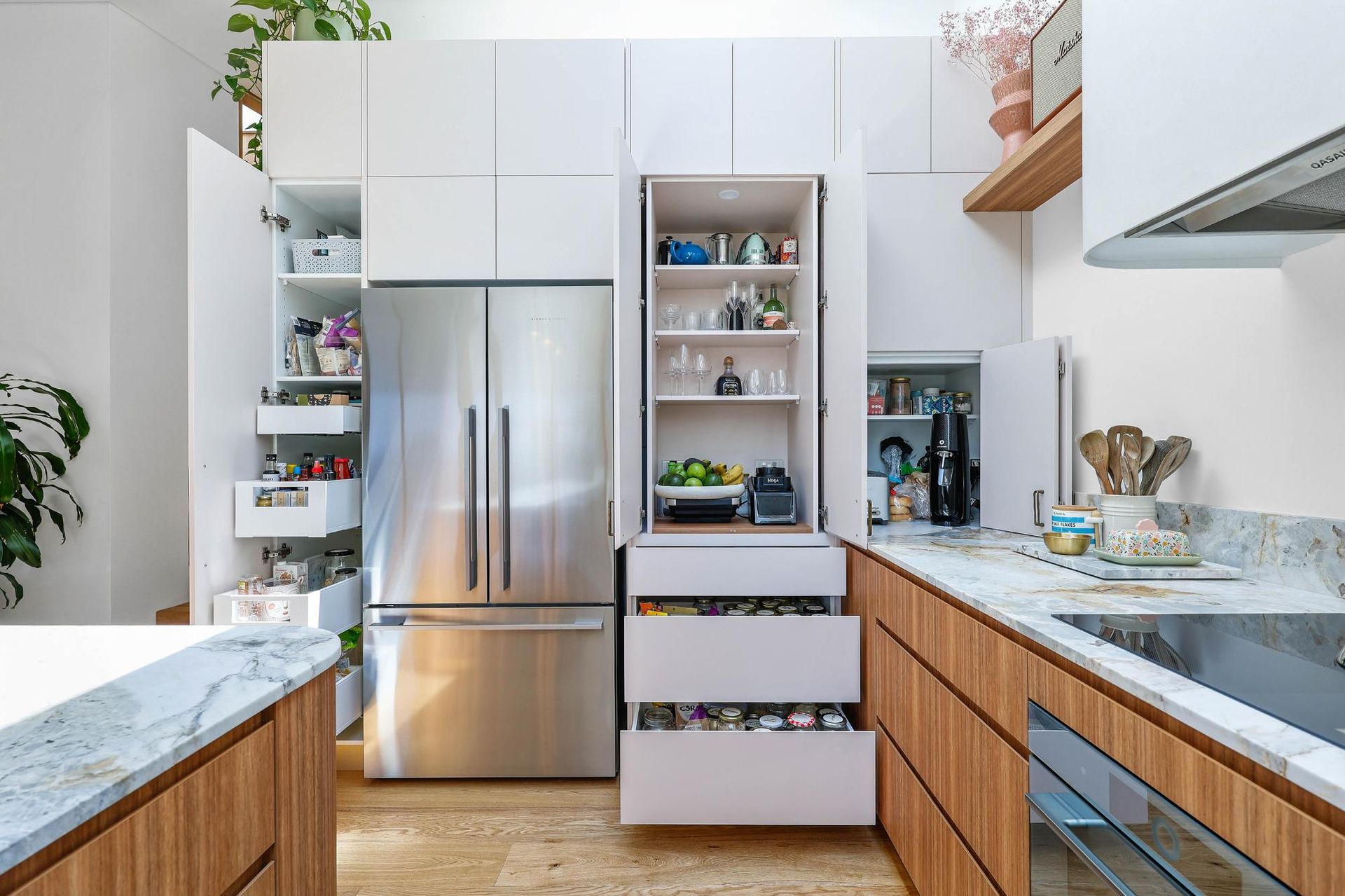 Modern Kitchen With Stainless Steel Fridge — Above & Beyond Interiors in Smeaton Grange, NSW