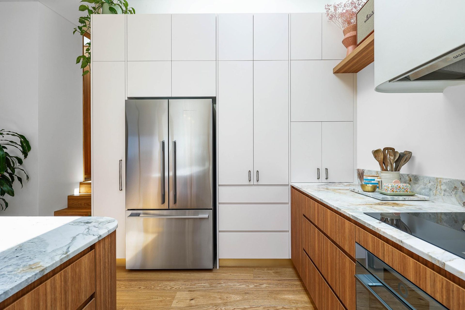 Modern Kitchen With Stainless Steel Refrigerator — Above & Beyond Interiors in Smeaton Grange, NSW