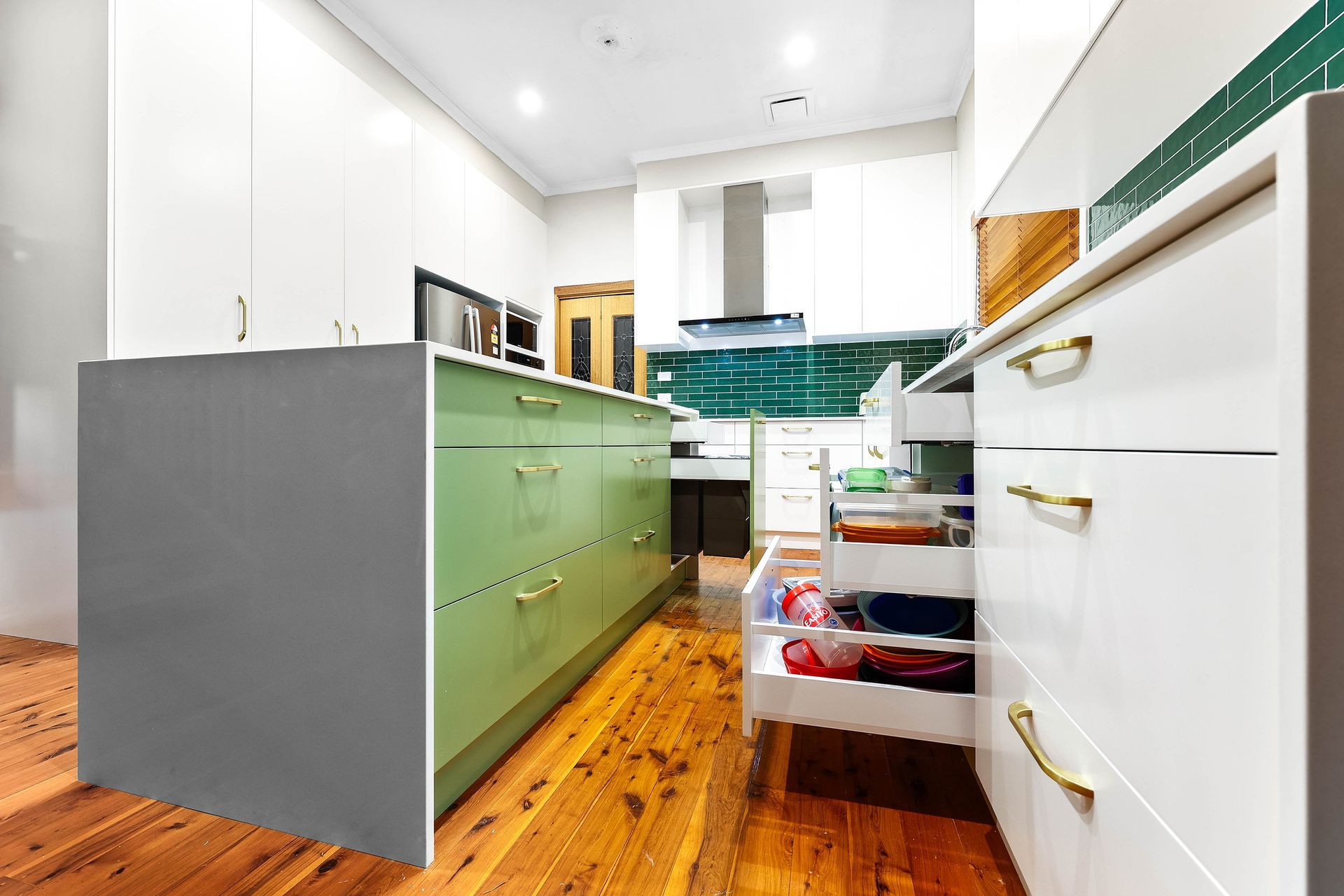 Modern Kitchen with Gray Island, White Cabinets — Above & Beyond Interiors in Smeaton Grange, NSW