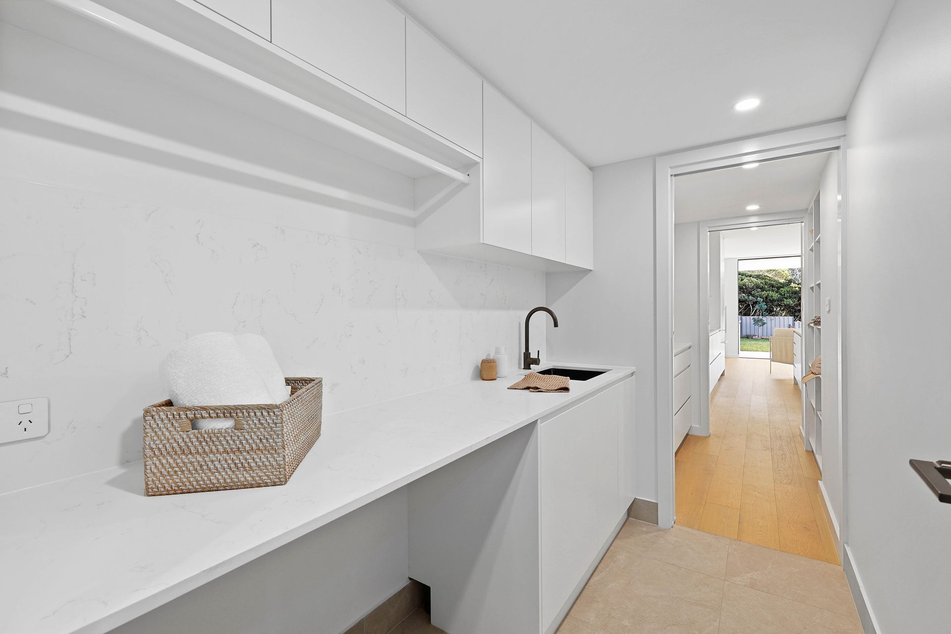 Bright White Hallway With Built-in Shelves — Above & Beyond Interiors in Smeaton Grange, NSW