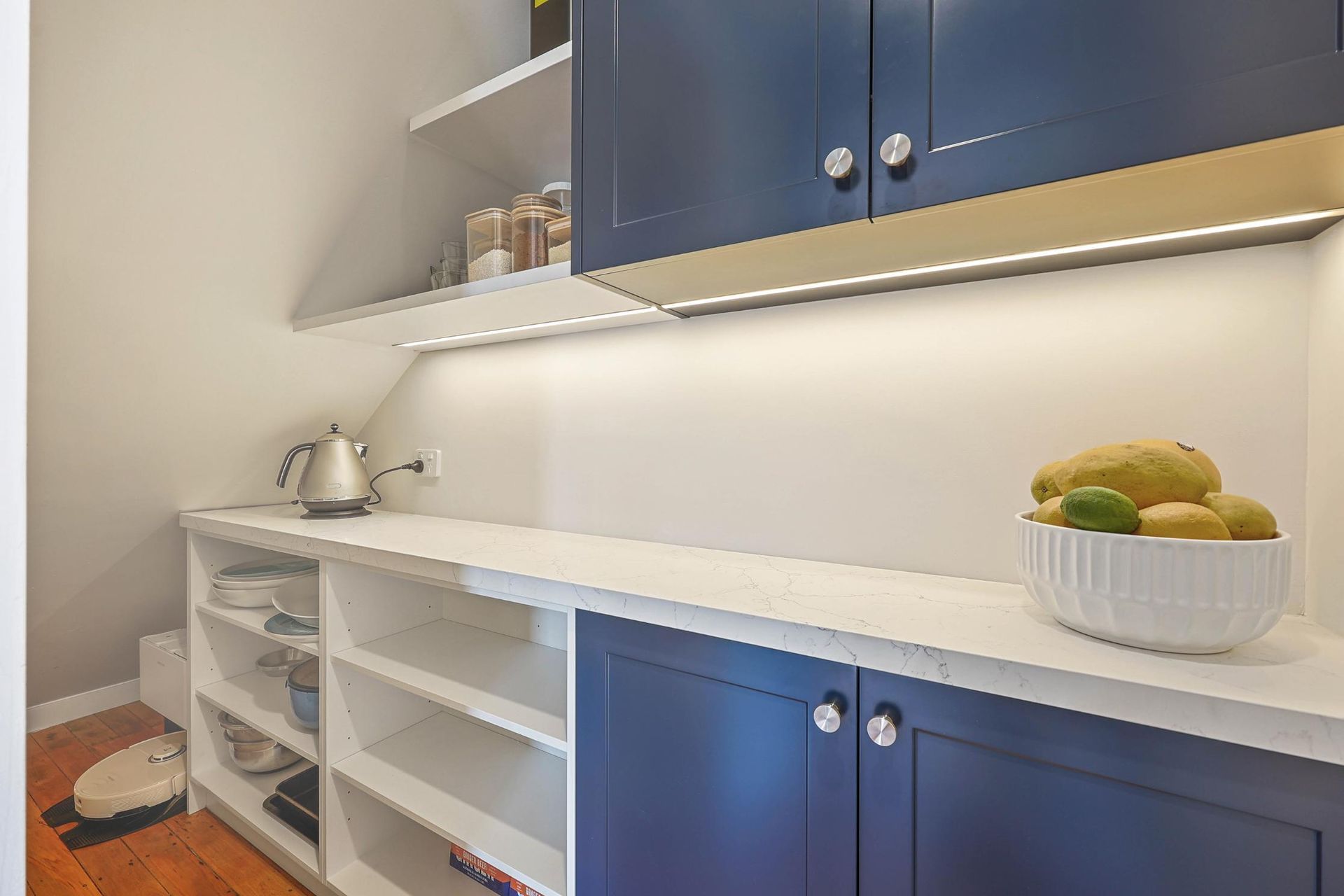 Small Kitchen With Blue Cabinets, White Countertop — Above & Beyond Interiors in Smeaton Grange, NSW