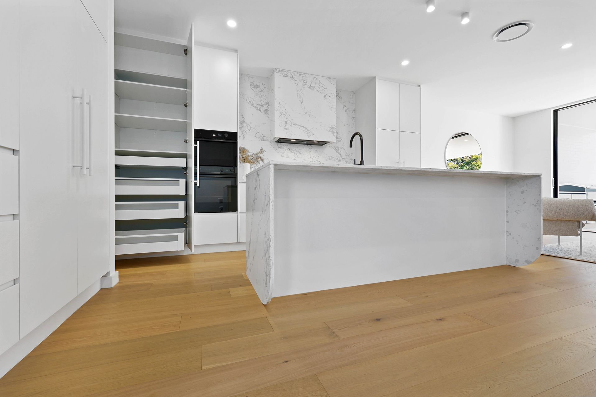 Bright Modern Kitchen With White Cabinets — Above & Beyond Interiors in Smeaton Grange, NSW