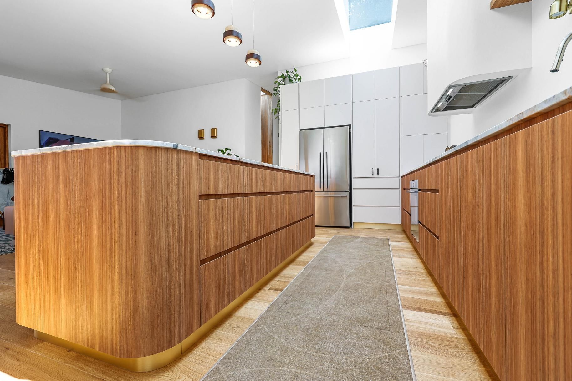 Modern Kitchen With Wood Island, White Cabinetry — Above & Beyond Interiors in Smeaton Grange, NSW
